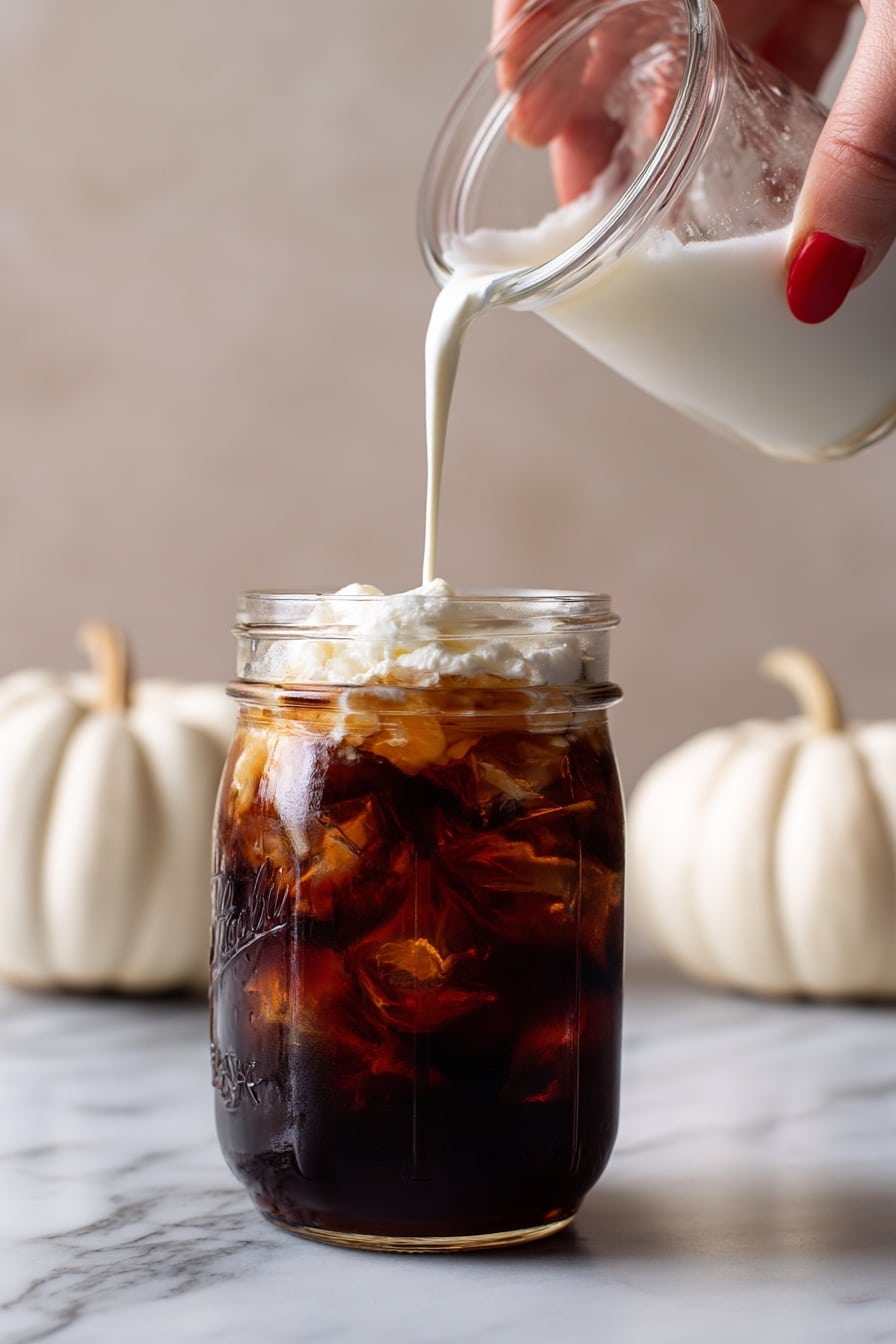 sweet cream cold foam - Flat lay of a small glass pitcher of whole milk with its creamy white texture, a dollop of thick heavy cream showing its rich and smooth surface, a small glass bowl filled with fine white powdered sugar, a tiny bottle of golden vanilla extract with a clear amber hue, and a few fresh vanilla bean pods with their dark glossy skin, all naturally arranged with soft shadows highlighting their fresh and creamy qualities, placed on white marbled surface, photo taken with an iphone --ar 2:3 --v 7